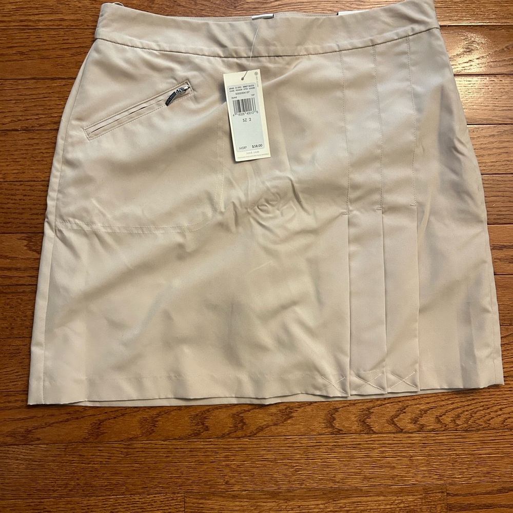 Izod golf skort. Never worn, new with tags.